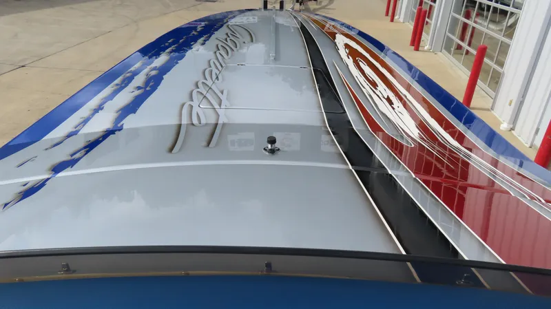 Slide: The Image of 2007 Cigarette 38 Top Gun boat with sleek, colorful design and reflective surface. - 11
