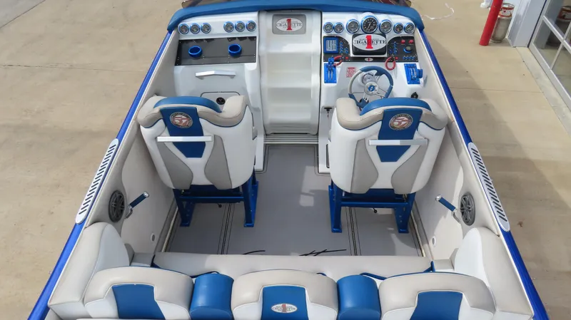 Slide: The Image of 2007 Cigarette 38 Top Gun boat interior with blue and white seating and dashboard. - 13
