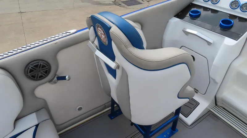 Slide: The Image of 2007 Cigarette 38 Top Gun boat interior with blue and white seating and dashboard. - 14