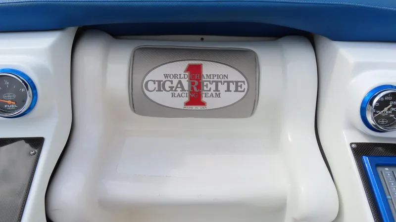Slide: The Image of 2007 Cigarette 38 Top Gun dashboard with racing team emblem. - 16
