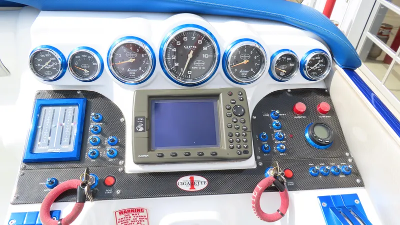 Slide: The Image of Dashboard of 2007 Cigarette 38 Top Gun boat with gauges and navigation system. - 19