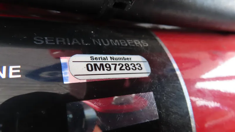 Slide: The Image of Close-up of 2007 Cigarette 38 Top Gun serial number: OM972833. - 22