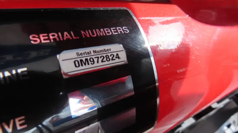 Slide: The Image of Close-up of 2007 Cigarette 38 Top Gun serial number: 0M972824. - 23