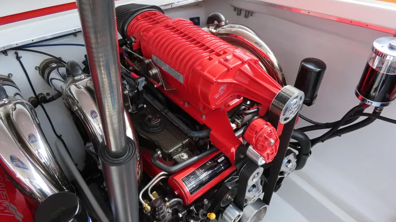 Slide: The Image of 2007 Cigarette 38 Top Gun engine with red components and chrome details. - 25