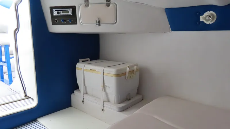 Slide: The Image of Interior of 2007 Cigarette 38 Top Gun boat with cooler and storage compartment. - 27