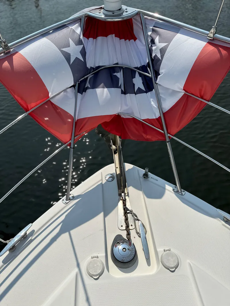 Slide: The Image of 2005 Carver 366 Motor Yacht bow with American flag decoration. - 11