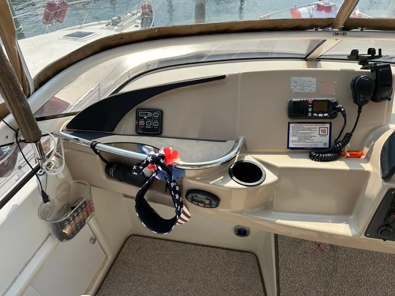 Slide: The Image of 2005 Carver 366 Motor Yacht helm with controls and radio equipment. - 12