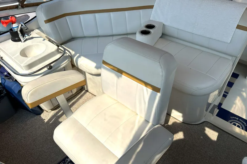 Slide: The Image of Interior of 2005 Carver 366 Motor Yacht with white seating and sink. - 14