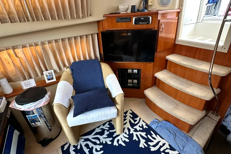 Slide: The Image of Interior of 2005 Carver 366 Motor Yacht with cozy seating and entertainment area. - 16