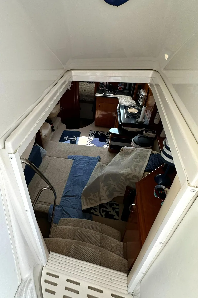Slide: The Image of Interior view of 2005 Carver 366 Motor Yacht, featuring cozy living space and nautical decor. - 17