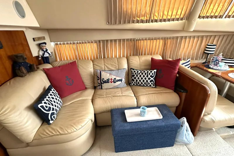 Slide: The Image of Luxurious interior of 2005 Carver 366 Motor Yacht with cozy seating and nautical decor. - 19