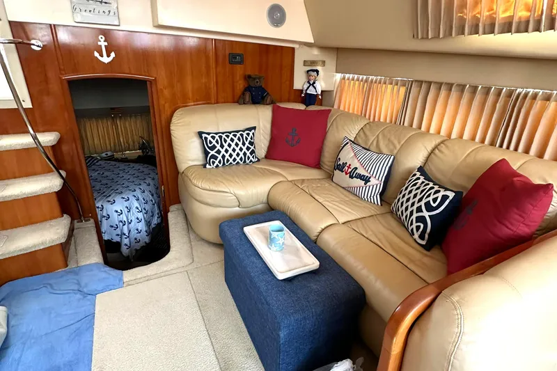 Slide: The Image of Interior of 2005 Carver 366 Motor Yacht with cozy seating and nautical decor. - 35