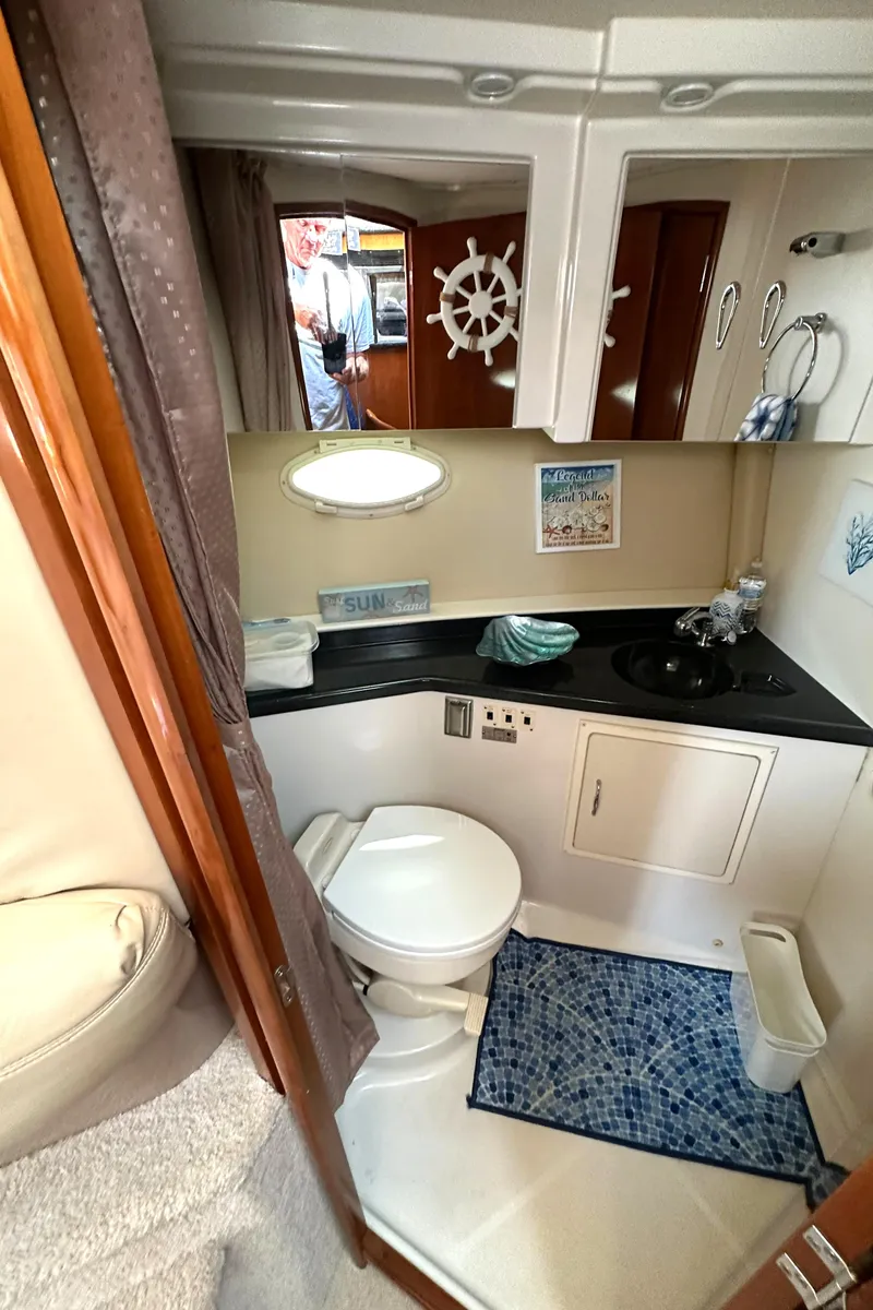 Slide: The Image of 2005 Carver 366 Motor Yacht bathroom with modern amenities and nautical decor. - 36