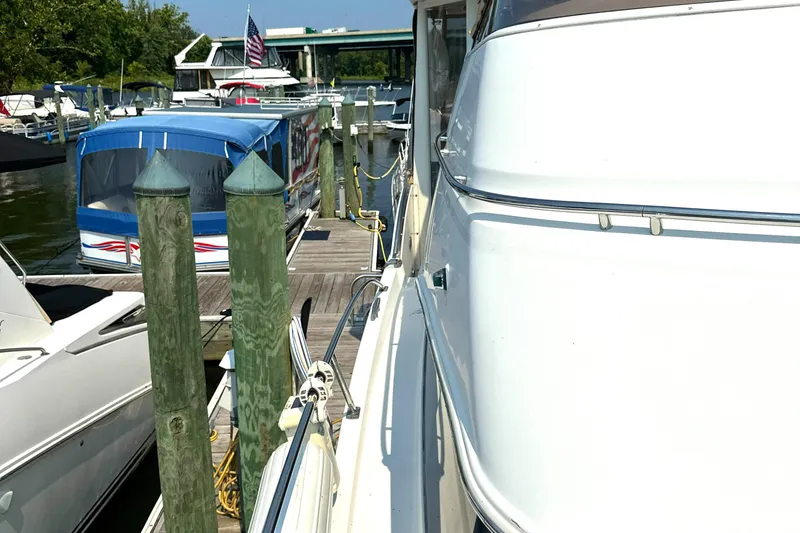 Slide: The Image of 2005 Carver 366 Motor Yacht docked at marina with other boats. - 37