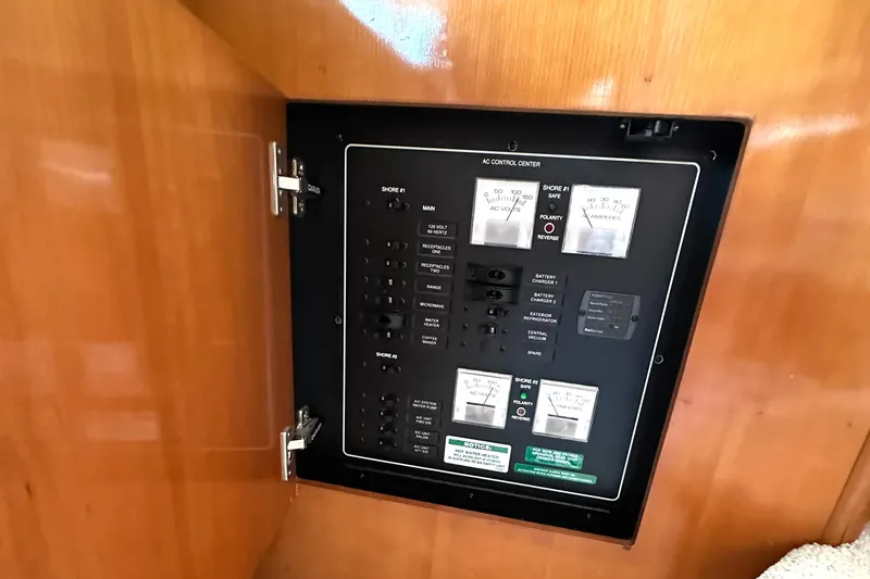 Slide: The Image of Electrical control panel on 2005 Carver 366 Motor Yacht, featuring switches and meters. - 41