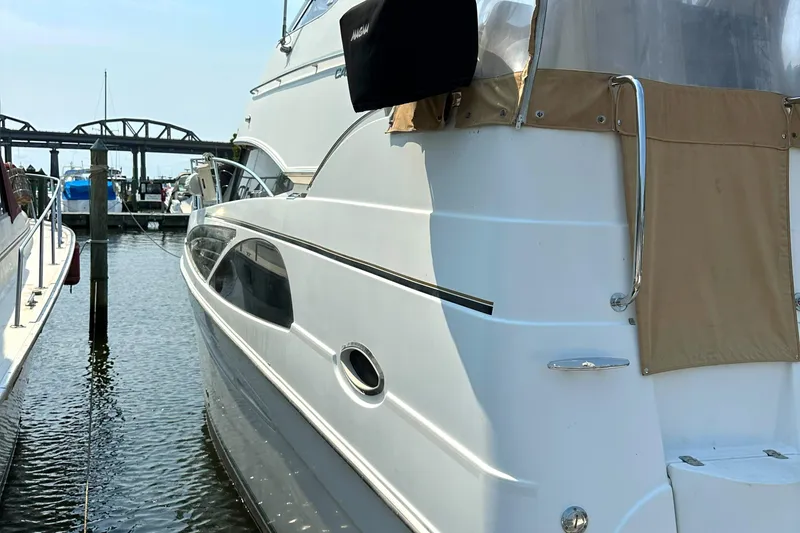 Slide: The Image of 2005 Carver 366 Motor Yacht docked at marina, side view. - 5