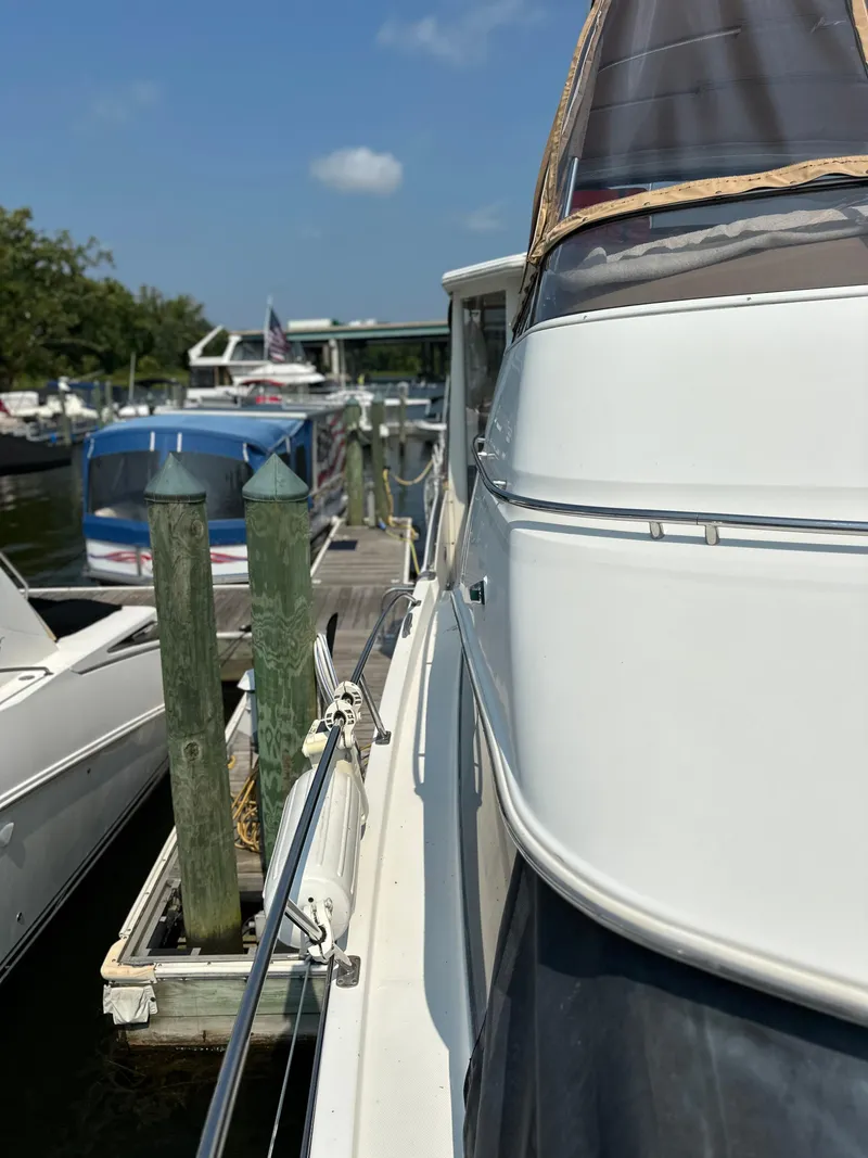 Slide: The Image of 2005 Carver 366 Motor Yacht docked at marina on a sunny day. - 6