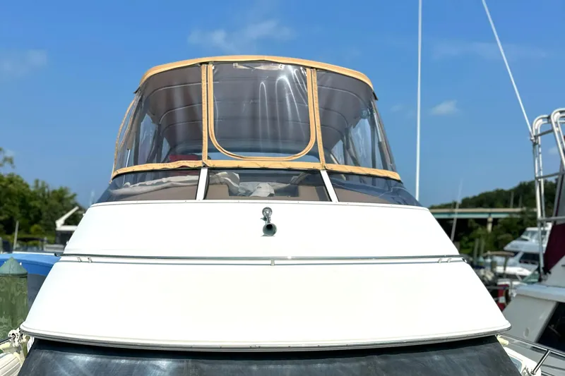 Slide: The Image of 2005 Carver 366 Motor Yacht docked under clear blue sky. - 8