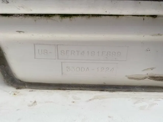 Slide: The Image of 1999 Sea Ray 330 Sundancer interior with sink and mounted TV. - 4