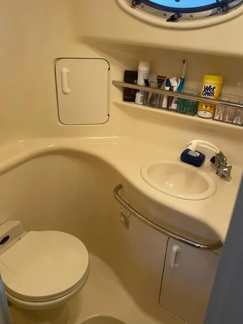 Slide: The Image of 1999 Sea Ray 330 Sundancer kitchen with microwave and fridge. - 7