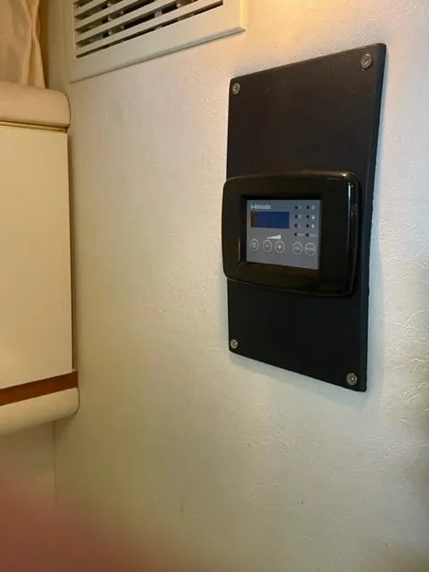 Slide: The Image of Interior of 1999 Sea Ray 330 Sundancer yacht with cozy seating and table. - 9