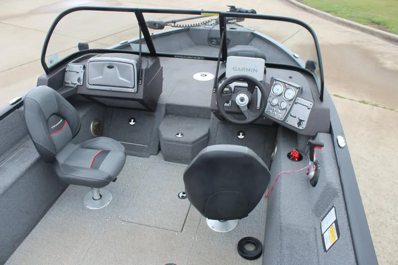 Slide: The Image of 2023 Tracker PG 175 WT SW boat interior with steering console and seating. - 12