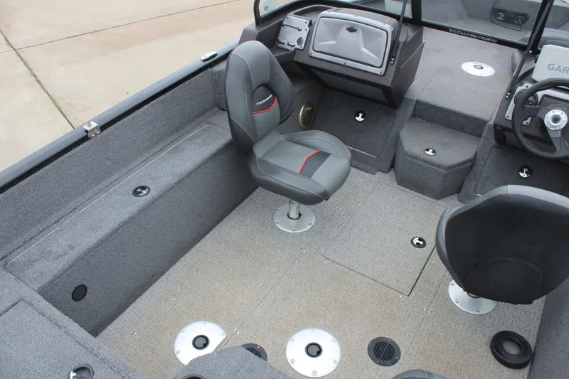 Slide: The Image of 2023 Tracker PG 175 WT SW boat interior with seating and console. - 13