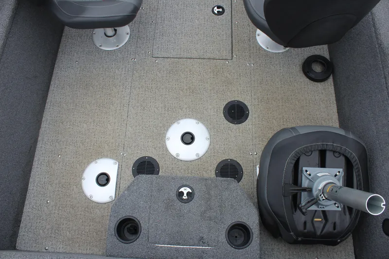 Slide: The Image of 2023 Tracker PG 175 WT SW boat interior with seating and storage compartments. - 14