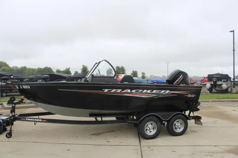 Slide: The Image of 2023 Tracker PG 175 WT SW boat on trailer, parked outdoors. - 2