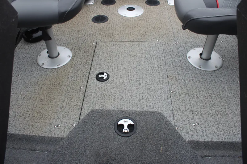 Slide: The Image of 2023 Tracker PG 175 WT SW boat interior with carpeted floor and swivel seats. - 23