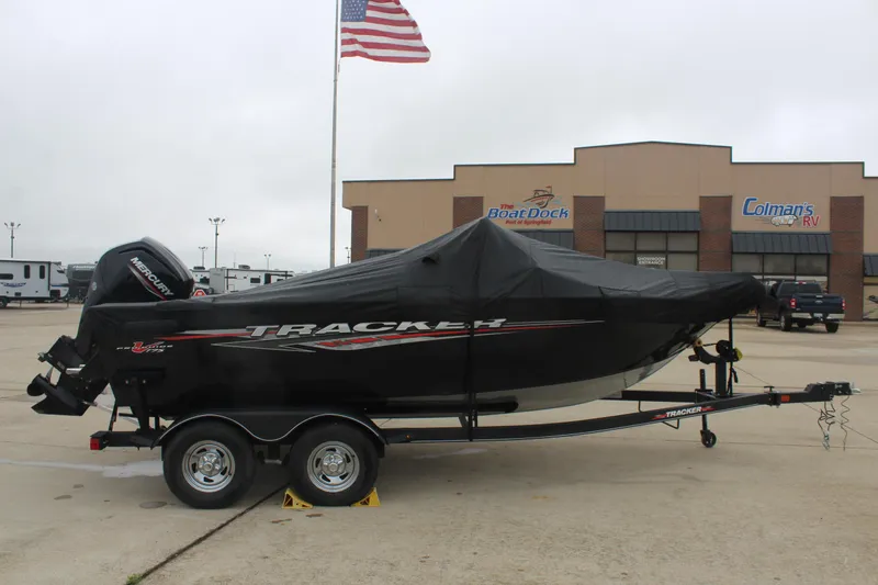 Slide: The Image of 2023 Tracker PG 175 WT SW boat on trailer, covered, parked outside dealership. - 5
