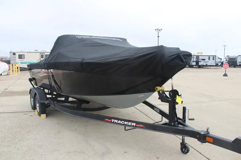 Slide: The Image of 2023 Tracker PG 175 WT SW boat on trailer, covered, parked in lot. - 6