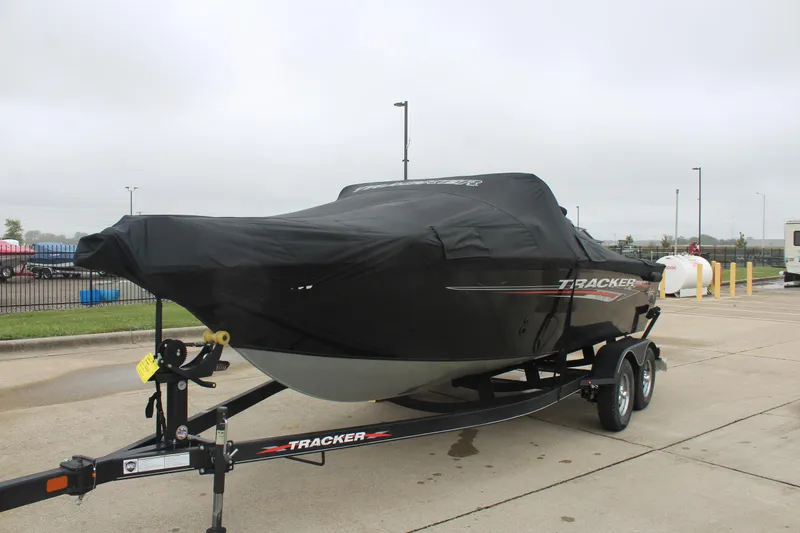 Slide: The Image of 2023 Tracker PG 175 WT SW boat covered on trailer in parking lot. - 7