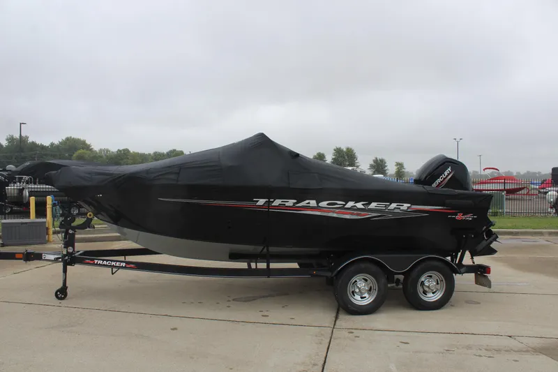 Slide: The Image of 2023 Tracker PG 175 WT SW boat with cover on trailer, parked outdoors. - 8