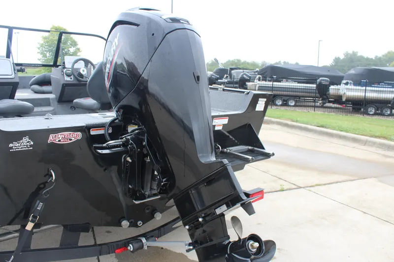 Slide: The Image of 2023 Tracker PG 175 WT SW boat with powerful outboard motor, parked outdoors. - 9