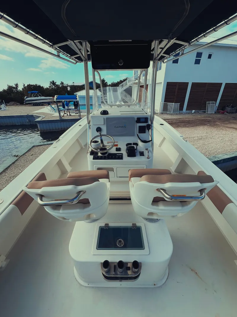 Slide: The Image of 2017 Parker 2801 Center Console boat interior with dual seats and control panel. - 21