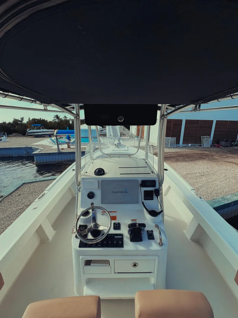 Slide: The Image of 2017 Parker 2801 Center Console boat interior with steering wheel and controls. - 23