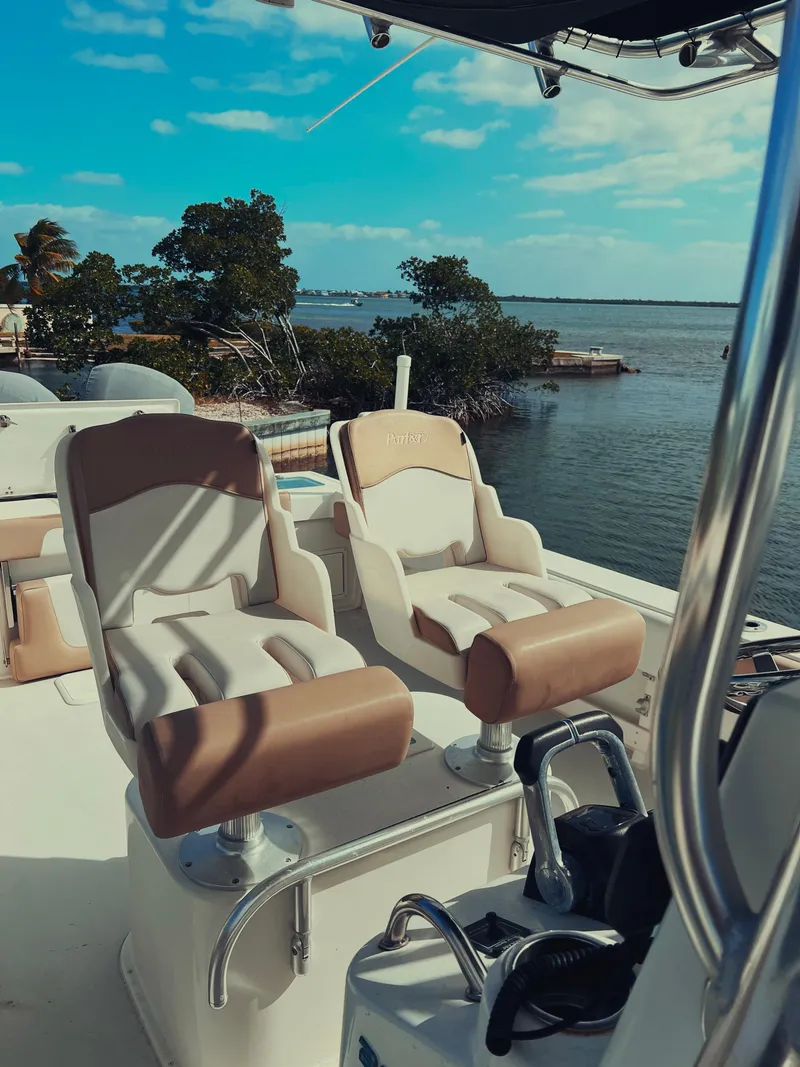 Slide: The Image of 2017 Parker 2801 Center Console boat with dual seats, overlooking serene waters. - 26