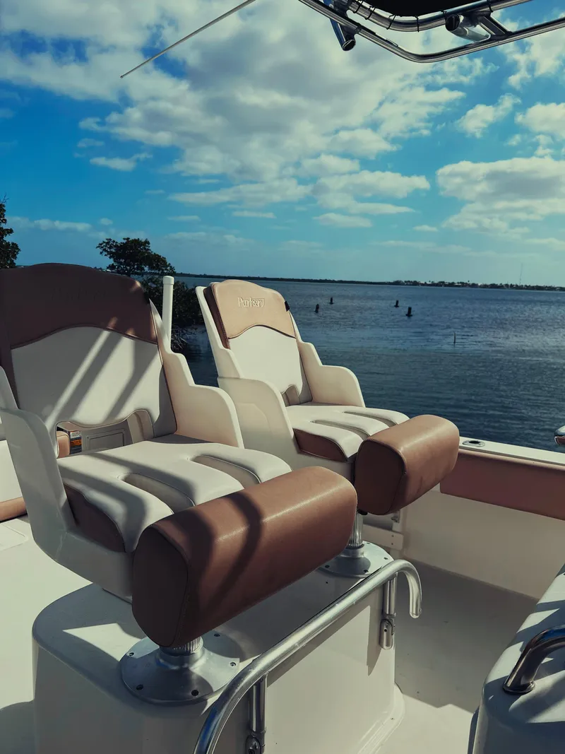 Slide: The Image of 2017 Parker 2801 Center Console boat seats with ocean view under blue sky. - 27
