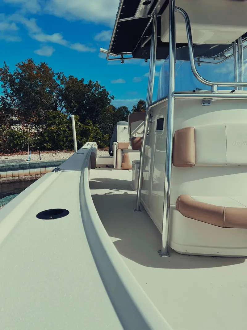 Slide: The Image of 2017 Parker 2801 Center Console boat docked, featuring spacious seating and sleek design. - 28