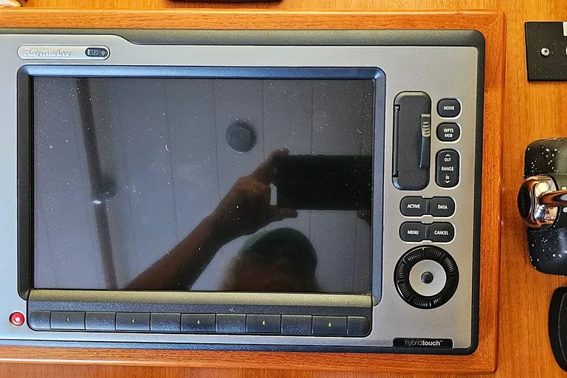 Slide: The Image of Close-up of a Raymarine E120W navigation system on a 2003 Menorquin 120 boat. - 10