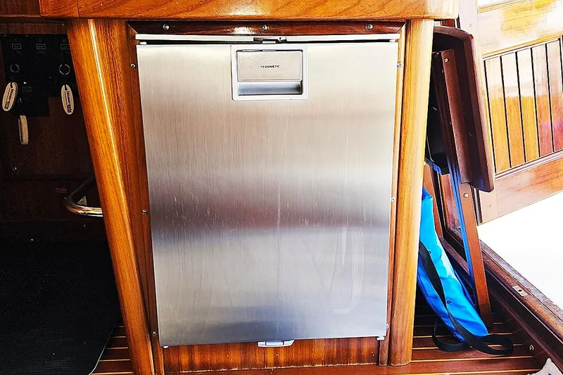 Slide: The Image of Stainless steel appliance on a 2003 Menorquin 120 boat with wooden interior. - 12