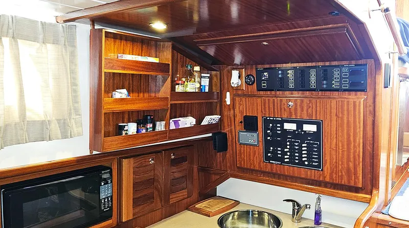 Slide: The Image of Interior of 2003 Menorquin 120 yacht with wooden cabinetry and control panel. - 22
