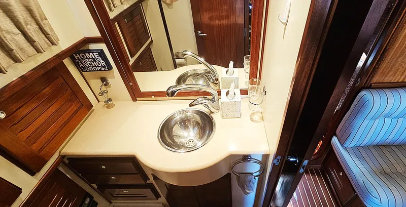 Slide: The Image of Bathroom in Menorquin 120 boat, 2003 model, featuring sink and mirror. - 28