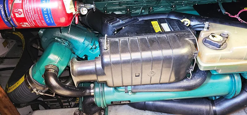 Slide: The Image of Engine compartment of a 2003 Menorquin 120 with green components. - 32