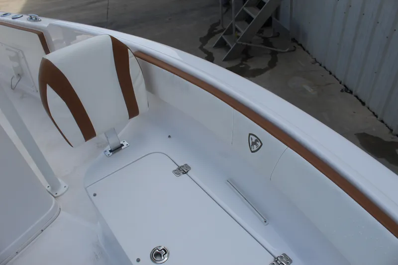 Slide: The Image of Century 2200 Center Console 2022 boat interior with white and brown seating. - 38