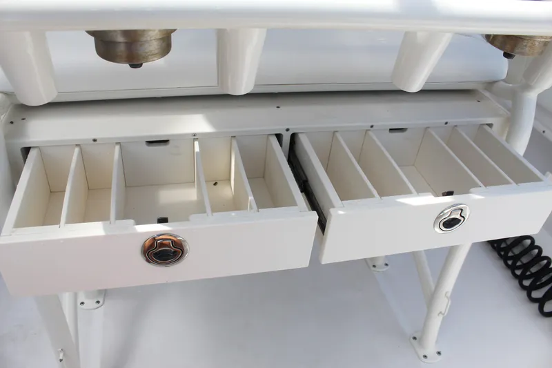 Slide: The Image of Century 2200 Center Console 2022 boat storage drawers with dividers. - 44