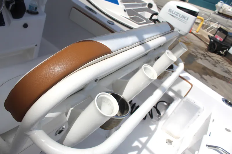 Slide: The Image of Century 2200 Center Console 2022 boat with rod holders and Suzuki engine. - 45