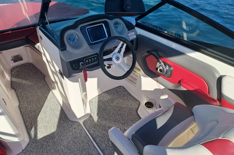 Slide: The Image of Interior of a 2016 Chaparral Vortex 203 VRX boat with modern dashboard and seating. - 5