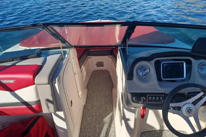 Slide: The Image of 2016 Chaparral Vortex 203 VRX boat interior with steering wheel and dashboard. - 6